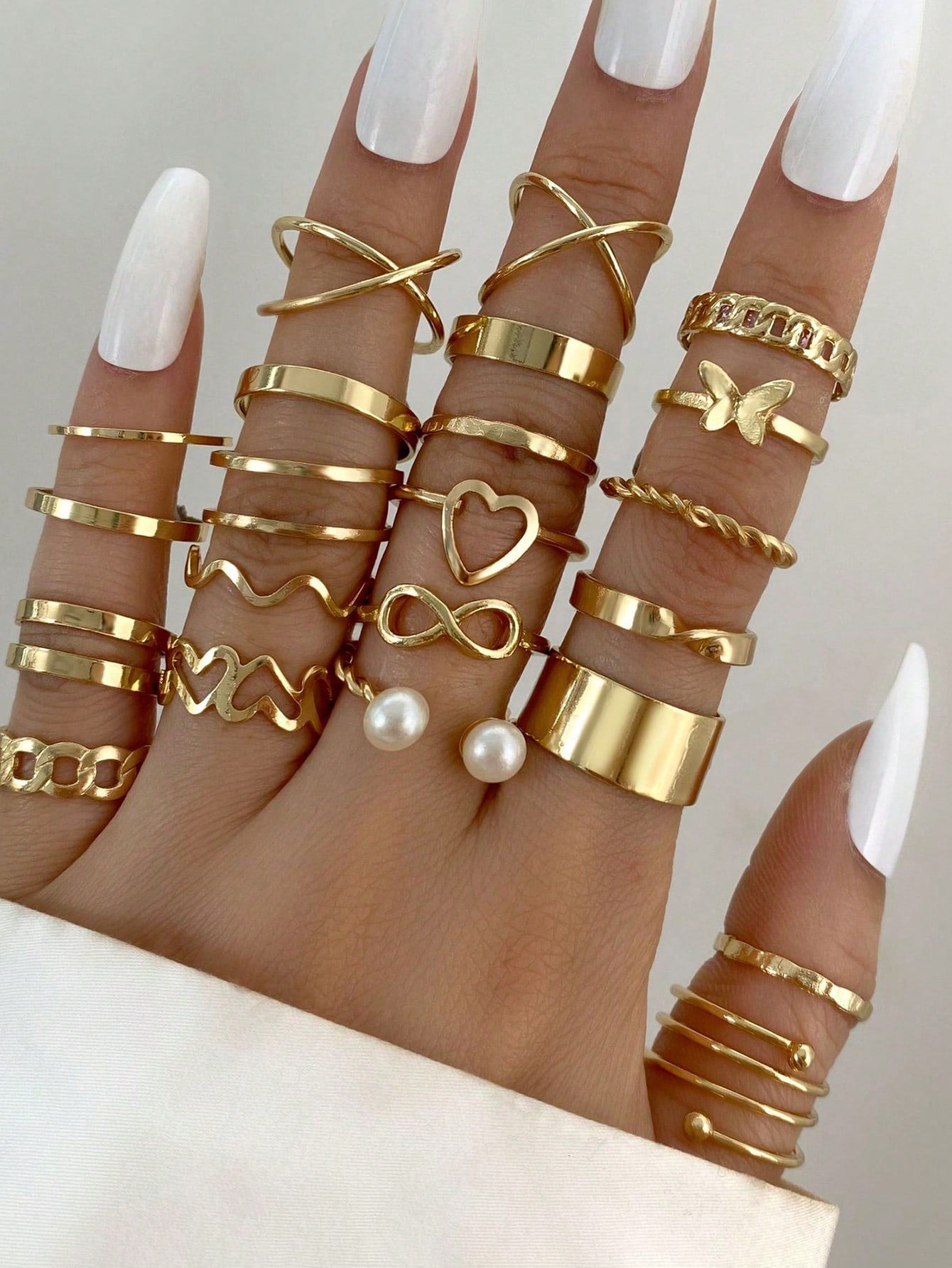 Set de 22 piezas de anillos multiarticulados con diseños de corazón y mariposa para niña