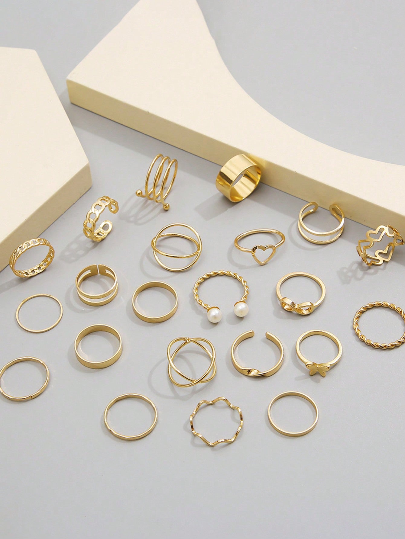 Set de 22 piezas de anillos multiarticulados con diseños de corazón y mariposa para niña