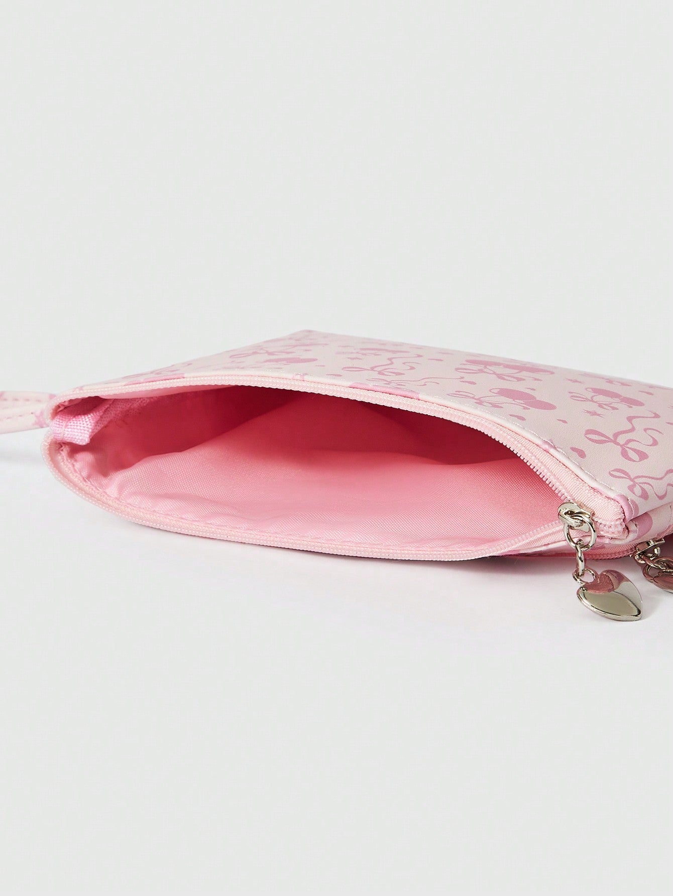 ROMWE Kawaii Bolsa con cremallera de gran capacidad con estampado de lazos de dibujos animados en toda la superficie