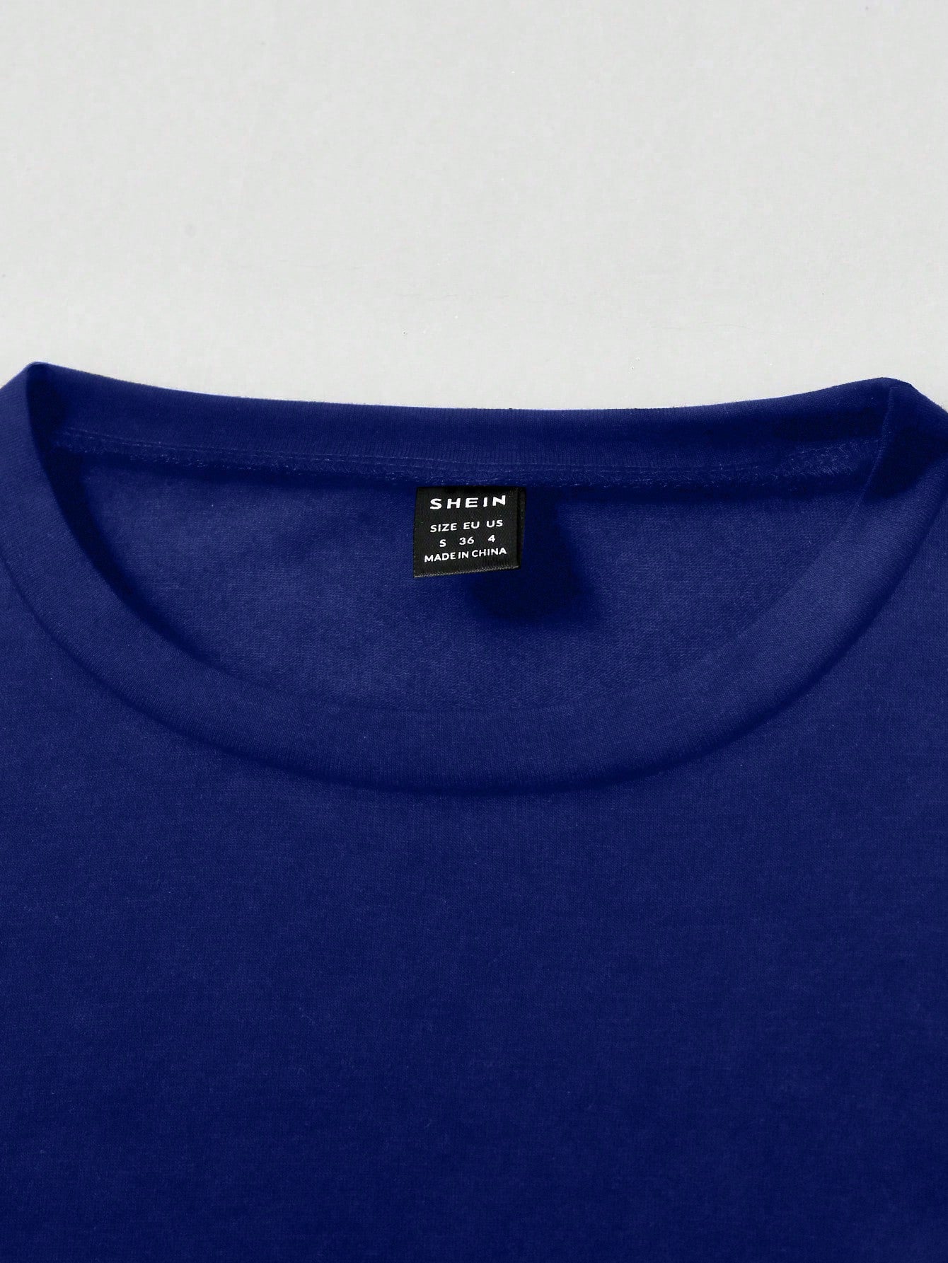 SHEIN MOOSTA Camiseta casual y elegante para mujer con cuello redondo, manga corta, volantes y lazo