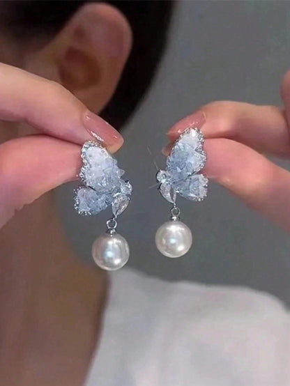 Un par de pendientes de círculo simple de plata rota con temperamento frío para niñas