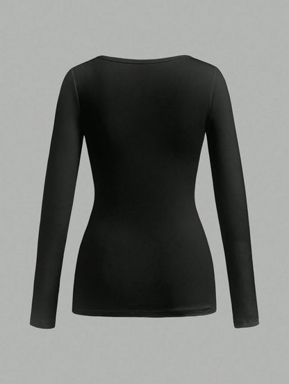 Attitoon Camiseta de manga larga con cuello en V casual y versátil con estampado de corazón y alas, adecuada para el aeropuerto en otoño/invierno