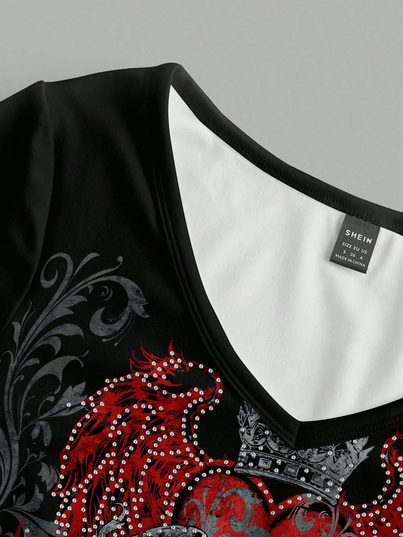 Attitoon Camiseta de manga larga con cuello en V casual y versátil con estampado de corazón y alas, adecuada para el aeropuerto en otoño/invierno