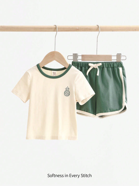 Cozy Pixies Conjunto de camiseta de manga corta con cuello redondo y pantalones cortos casuales con estampado de piña de dibujos animados y bloques de color para bebé niño