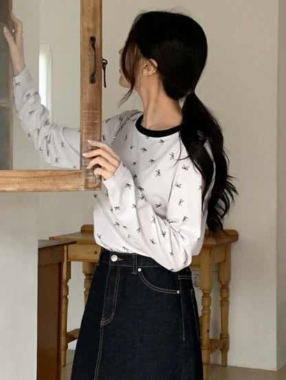 DAZY Camiseta de manga larga con cuello redondo y estampado de moño para mujer