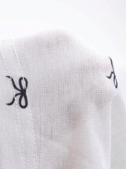 DAZY Camiseta de manga larga con cuello redondo y estampado de moño para mujer