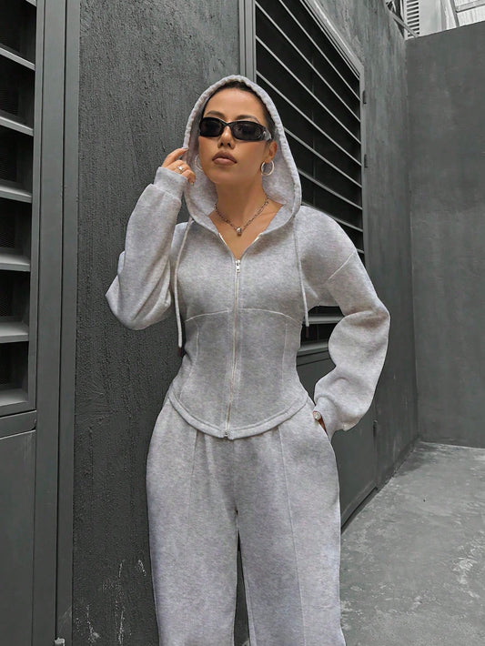 Flirla Conjunto casual de dos piezas para mujer, que incluye sudadera con capucha de manga larga con cremallera delantera y hombros caídos, y pantalones de unicolor