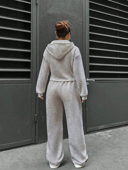 Flirla Conjunto casual de dos piezas para mujer, que incluye sudadera con capucha de manga larga con cremallera delantera y hombros caídos, y pantalones de unicolor