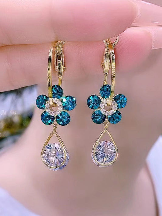 1 par de aretes con forma de flor con diseño de gota de agua