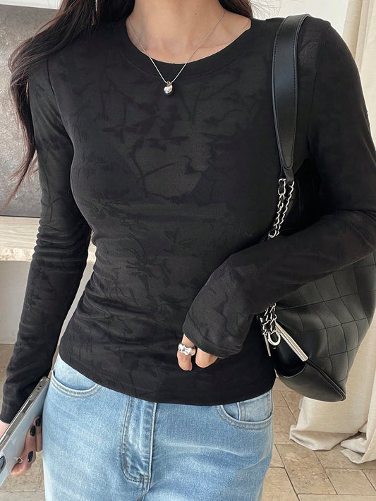 Camiseta de manga larga ajustada de mujer con tela texturizada semi transparente