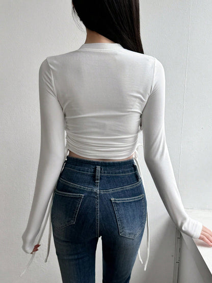DAZY Camiseta de manga larga con cintura ceñida de color liso para mujer