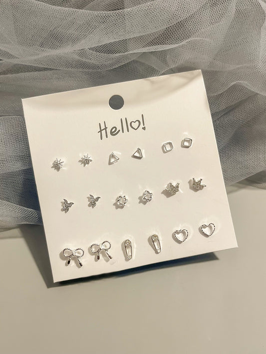 9 pares de aretes tipo puntas con corona y moño para San Valentín