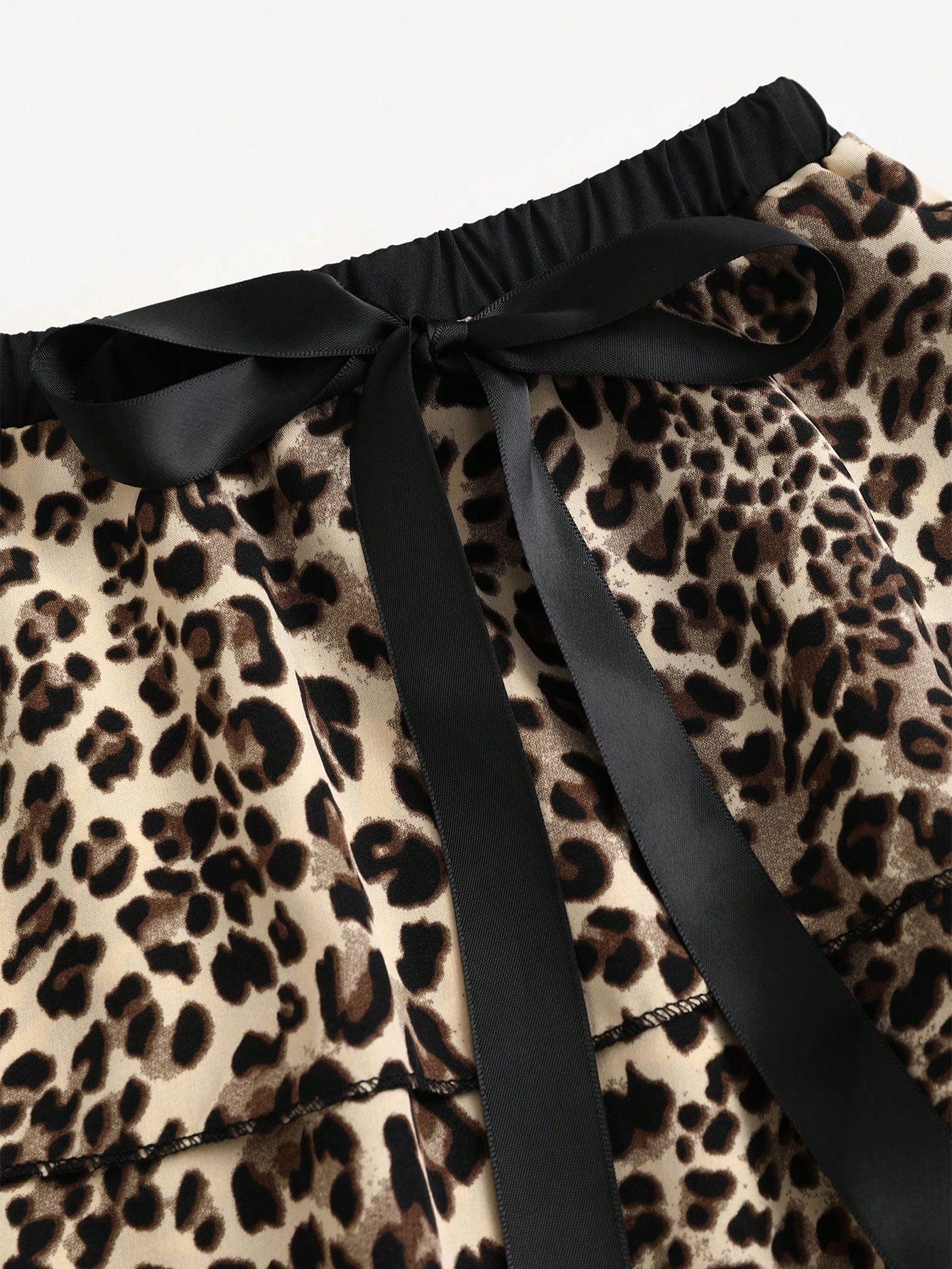 EgrlEra Falda en línea A con varios pliegues, de cintura baja, con estampado de leopardo, y un lazo decorativo en contraste de color negro para mujeres