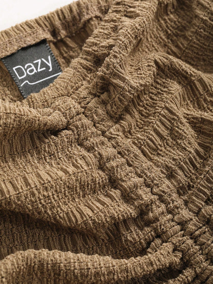 Dazy Designer Camisa de mujer con hombros al descubierto, de manga corta con pliegues, en tela con textura y diseño con sentido