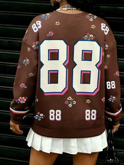 Rovax Sudadera casual de mujer con cuello redondo y hombros caídos, con estampado floral y numérico, para otoño