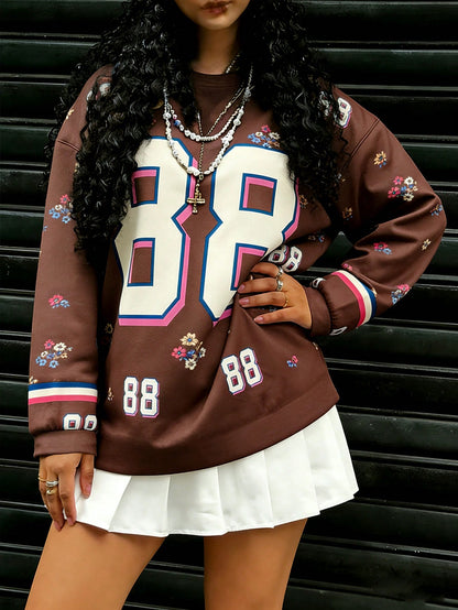 Rovax Sudadera casual de mujer con cuello redondo y hombros caídos, con estampado floral y numérico, para otoño