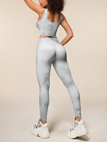 SHEIN Sport Easify Conjunto deportivo sin mangas con top de efecto tie-dye y leggings sin costuras para mujeres